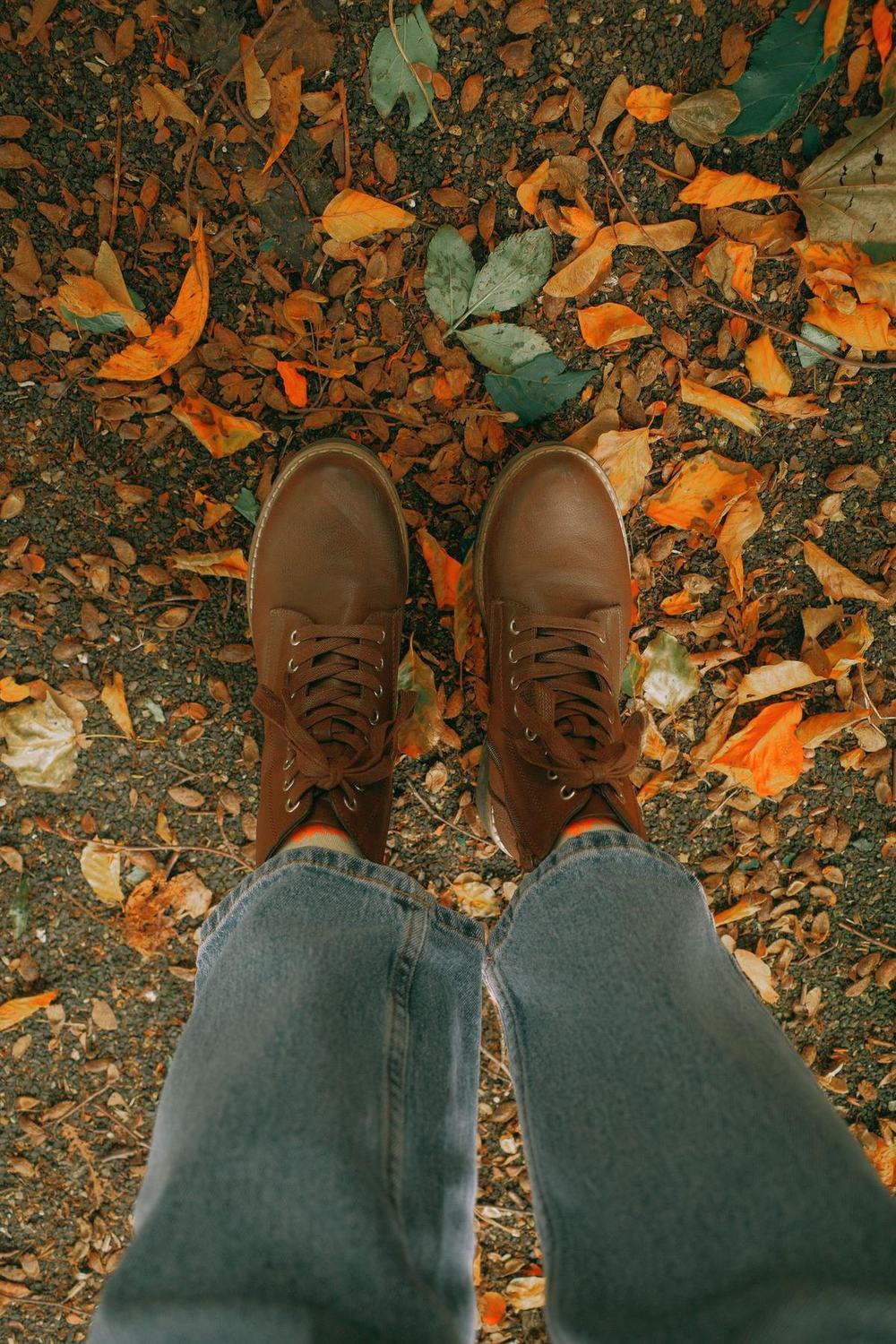 Boots on autumn leaves