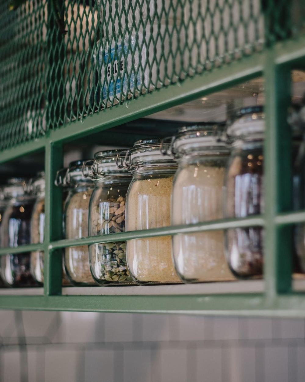 Clip-top glass jars on a shelf