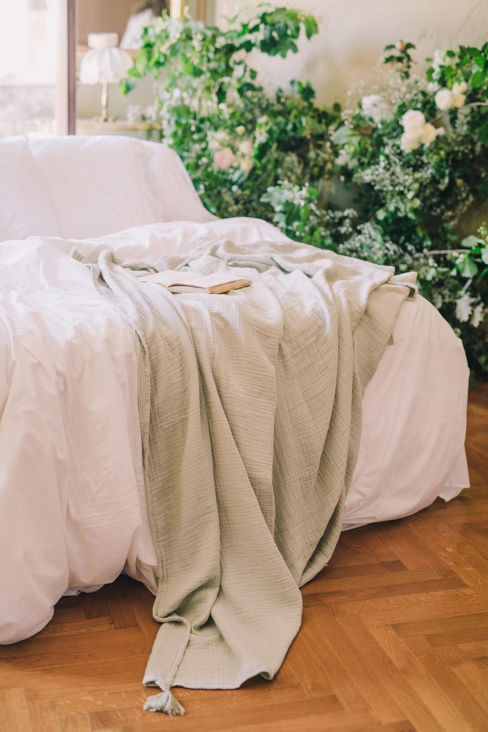 Sage muslin throw on a bed