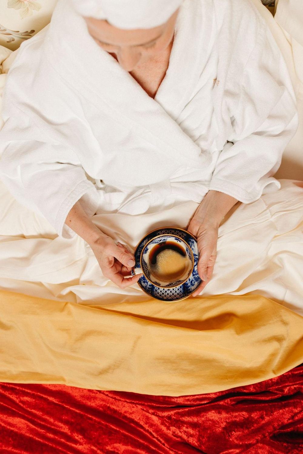 Soft white robe with a cup of coffee