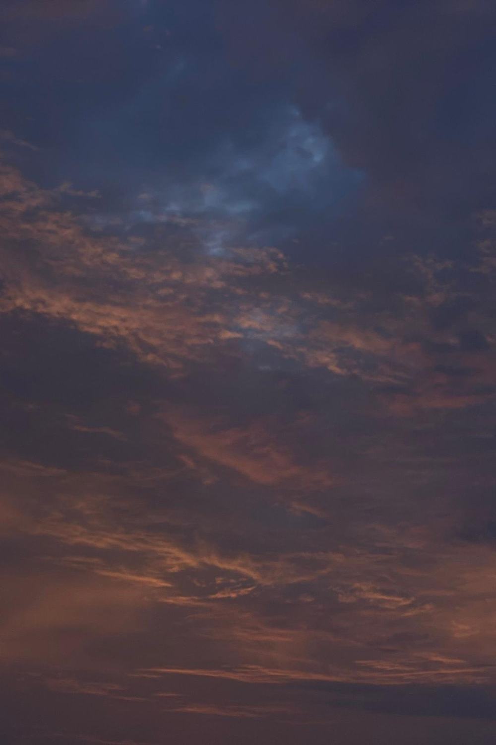 An early morning sky with the first warm light on the clouds